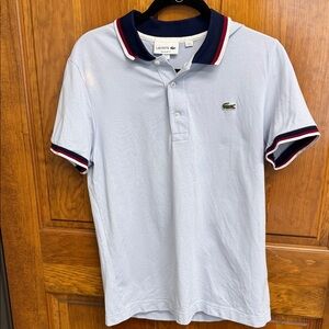 Lacoste men’s regular fit polo. Size Medium. Light blue with contrasting collar